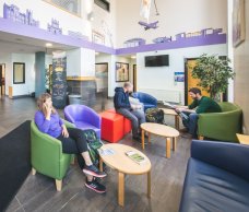Reception - International Youth Hostel in Belfast Three People in the Reception of the International Youth Hostel in Belfast
