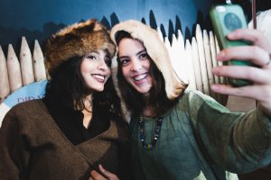 Two girls taking selfie dressed up as vikings 