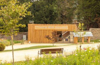 Avondale Treetop Walk Wooden Building - entry gates with a big silver sign Treetop Walk Avondale