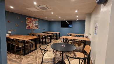 School Groups Friendly Restaurant in Dublin Dining Area with tables, chairs and TV screenHostel Restaurant For Groups in Dublin