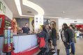 Reception Hall in Abigails Youth Hostel for Groups Accommodation in Dublin Group of Backbackers Getting Information about Cliffs of Moher Day Tour@ The Reception and Tourist Information Desk in Hostel in Dublin