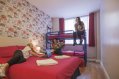 Triple Room - Double Bed and Bunk Bed Family Room Used for Trip Leaders' Accommodation in Abigails Hostel in Dublin Three Guests in Triple Room in Youth Hostel
