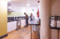 Ashfield Hostel Self Catering Kitchen with Prep Area and Food Storage Facilities Tourists Preparing Food in the Self-Catering Kitchen in Hostel