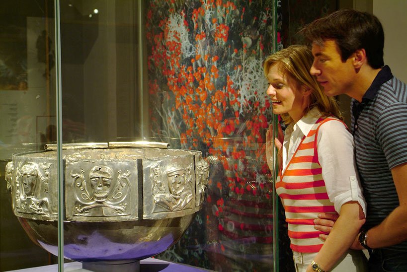 A couple enjoying an archaeology ppiece at the National Museum of Ireland 