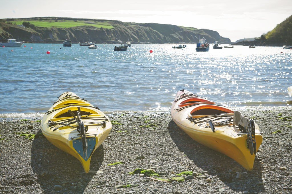 Sea Kayaks on the Beach Waiting For Exploring Coastal Trip of the South Western Ireland 